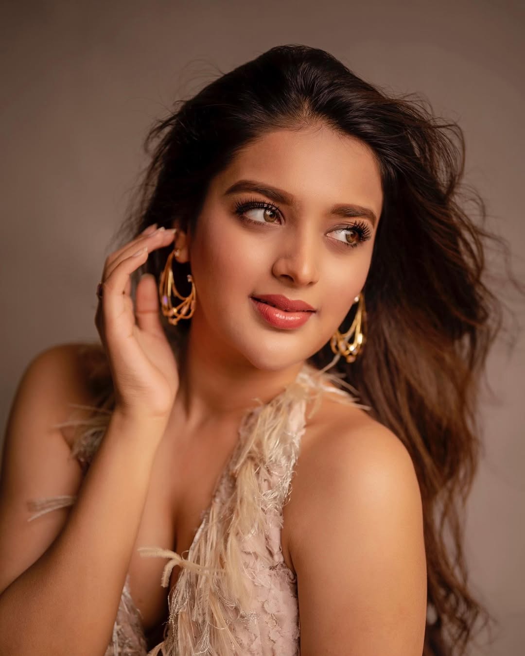 Nidhhi Agerwal Looks Ethereal in a Feather-Detailed Pink Lace Look