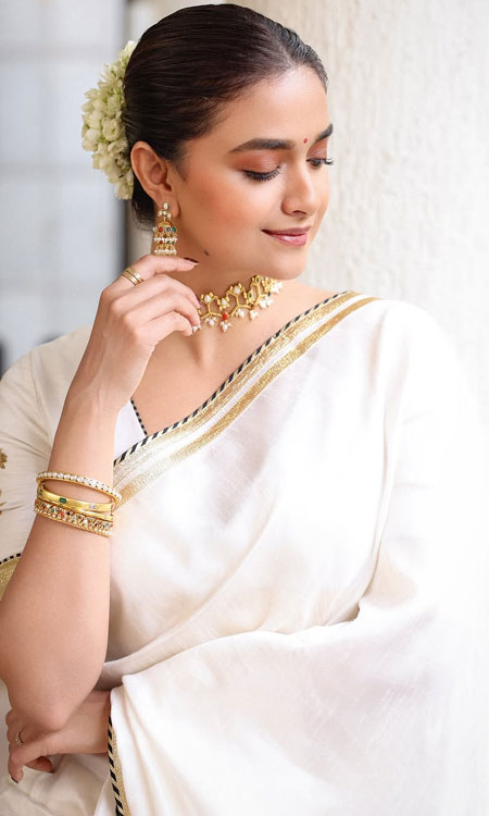 Keerthy Suresh Looks Regal in a Classic White Saree and Gold Jewellery