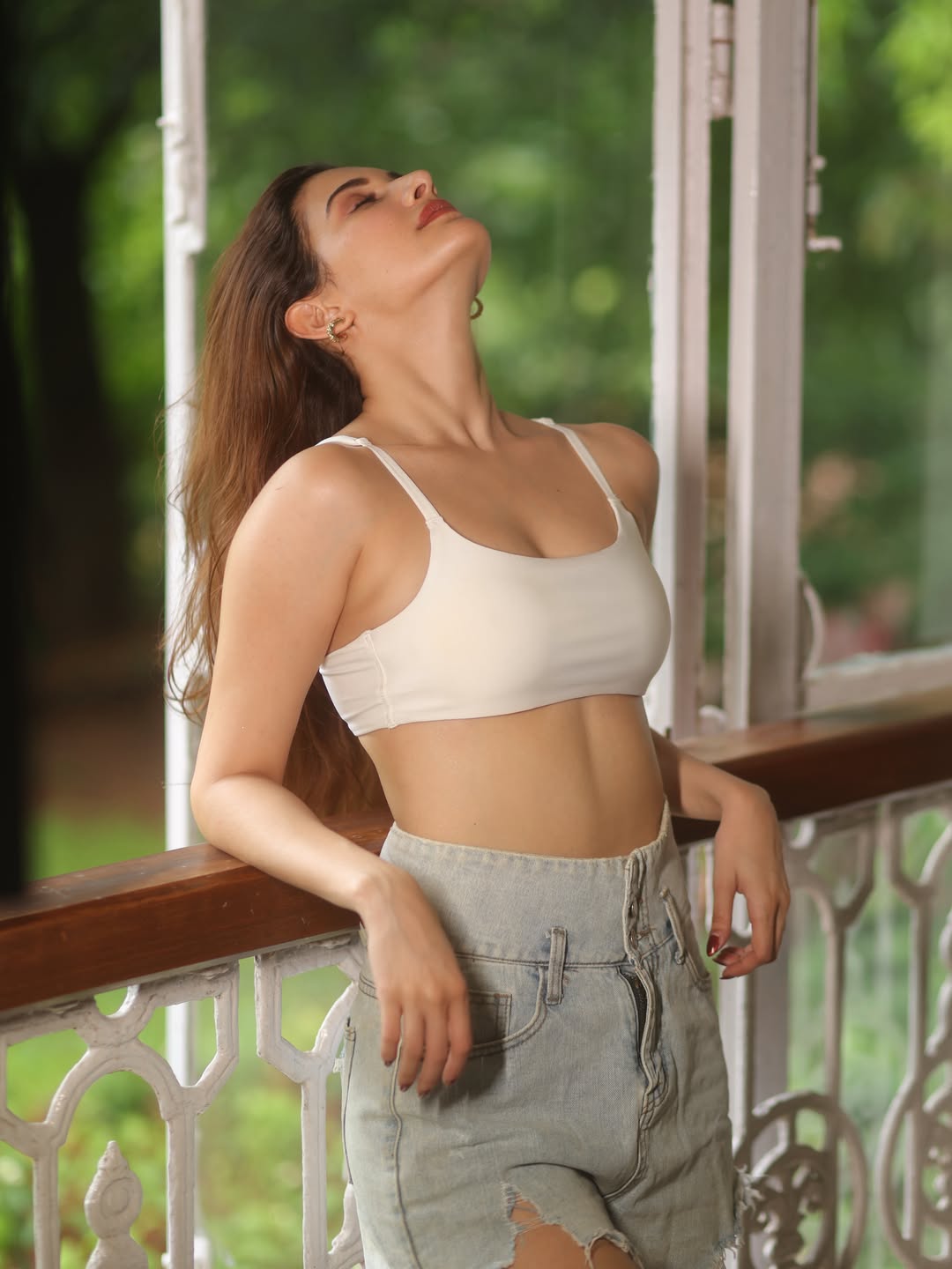Amyra Dastur’s Serene Balcony Look in White Crop Top and Denim Shorts