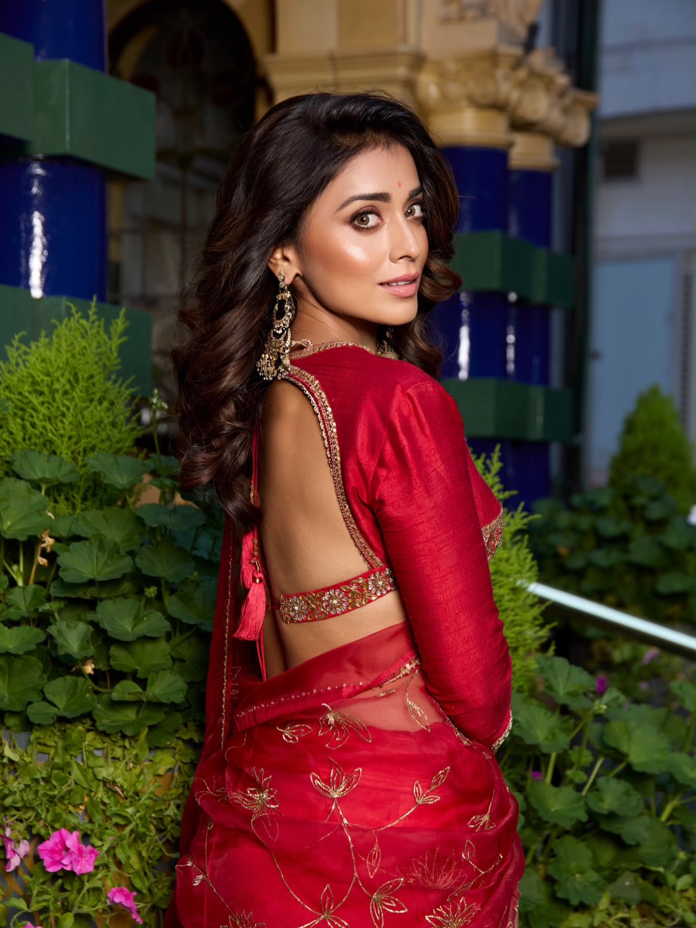 Shriya Saran Looks Radiant in Stunning Red and Gold Ensemble