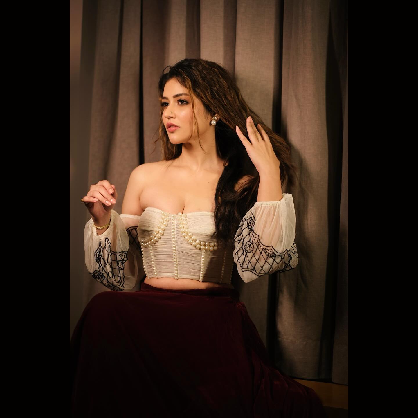 Priyanka Jawalkar Stuns in a White Corset and Maroon Velvet Skirt