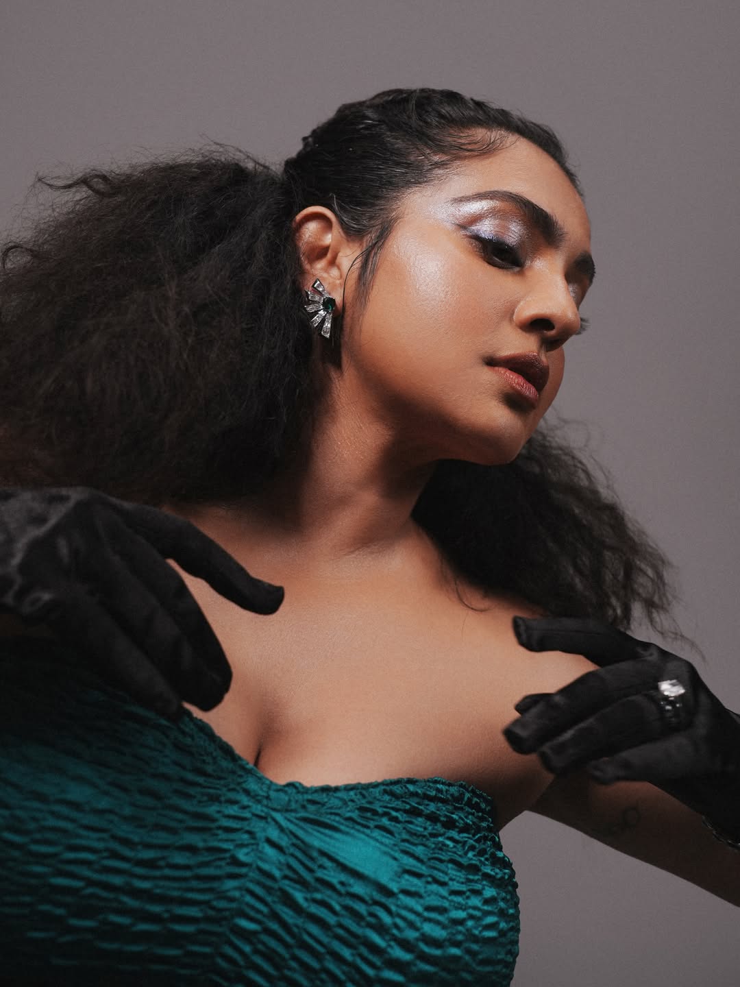 Parvathy Thiruvothu Turns Heads in a Striking Teal Ruffled Gown