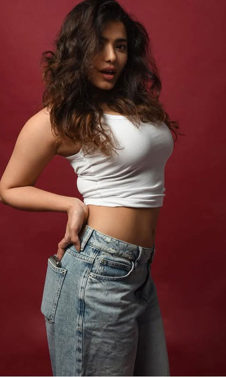 Ketika Sharma Stuns in a White Crop Top and Blue Denim Jeans