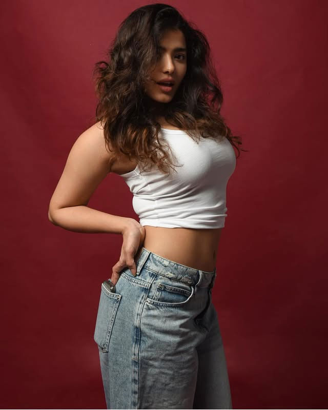 Ketika Sharma Stuns in a White Crop Top and Blue Denim Jeans