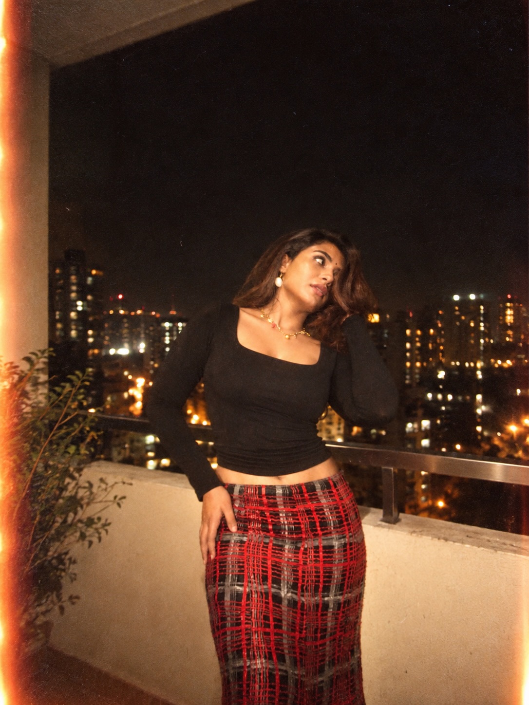Nayan Sarika Turns Up the Heat in a Black Top and Red Plaid Skirt