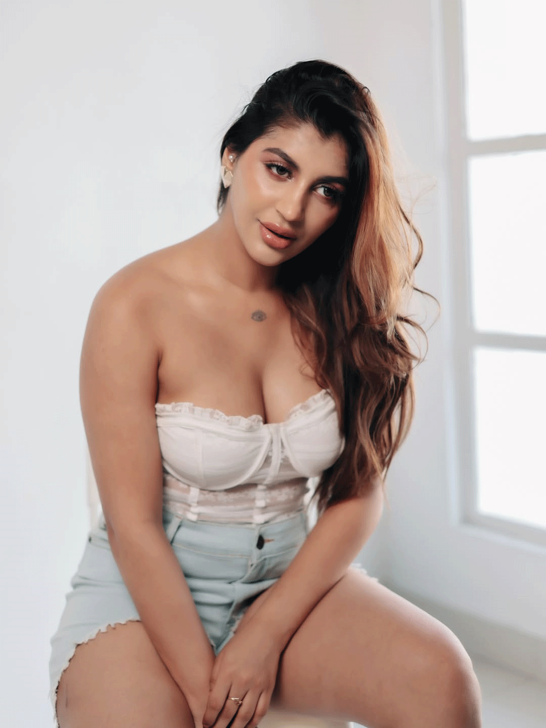 Yashika Aannand Stuns in White Lace Corset Top and Denim Shorts