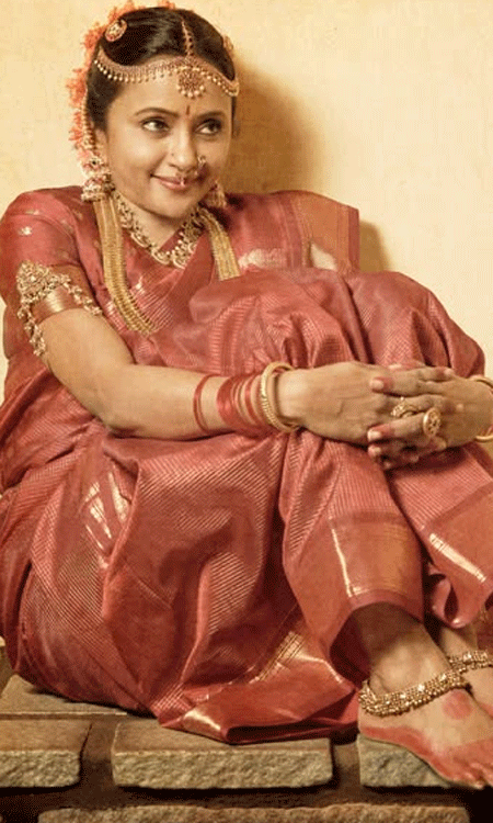 Suma Kanakala Looks Regal in a Crimson Silk Saree and Temple Jewelry