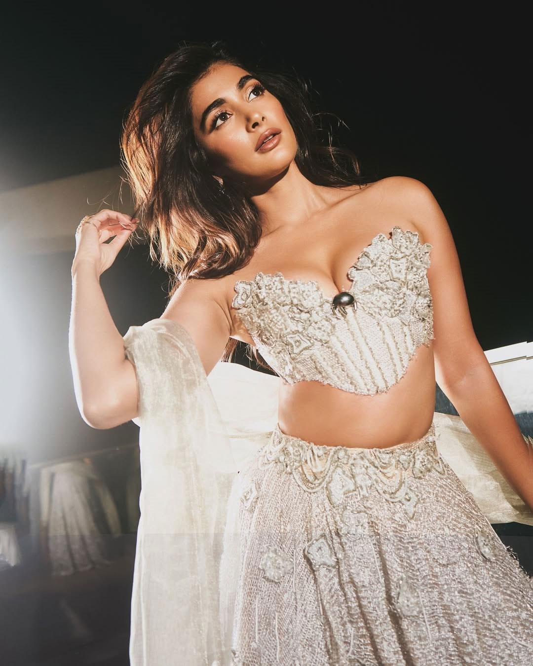 Pooja Hegde Stuns in an Ivory Lehenga With Royal Elegance
