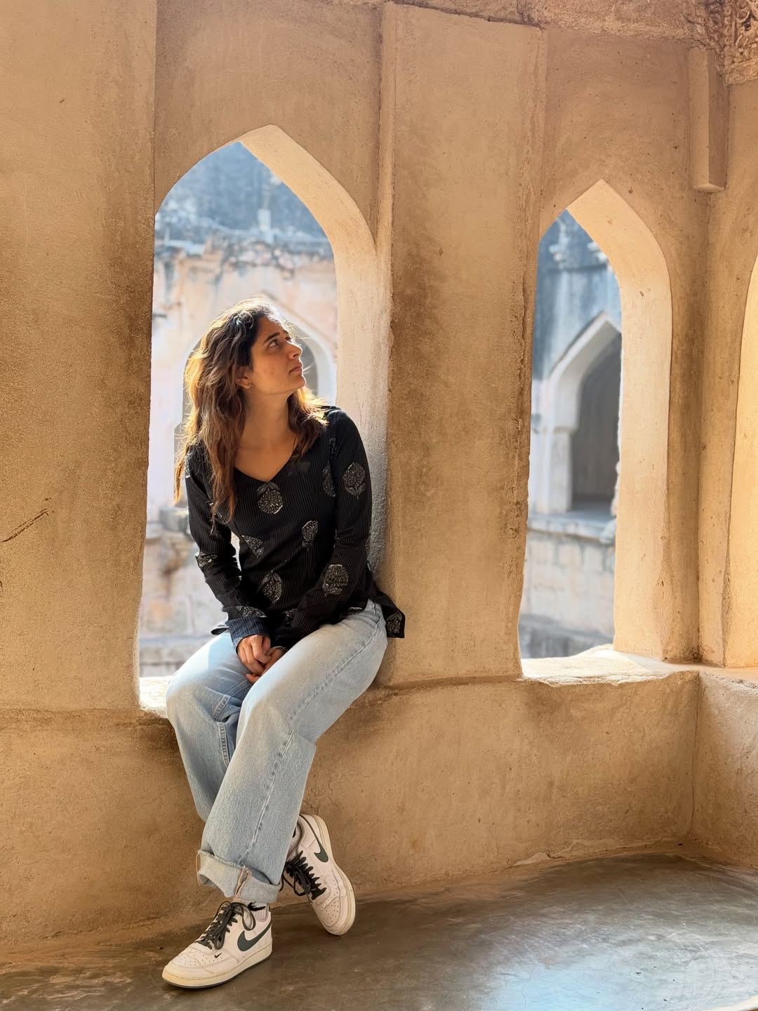 Ashika Ranganath Looks Stylish in a Black Outfit by a Vintage Convertible