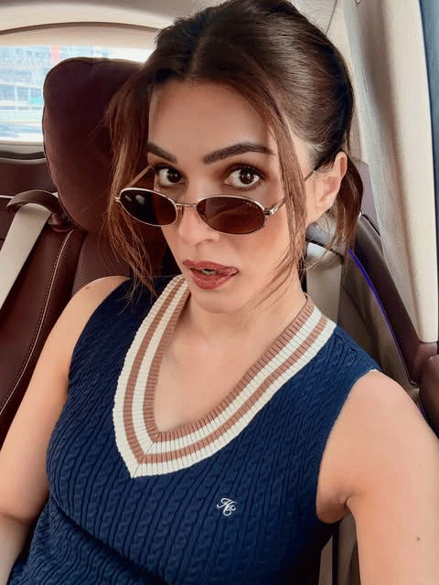 Kriti Sanon Looks Chic in Navy Knit Top and Retro Sunglasses