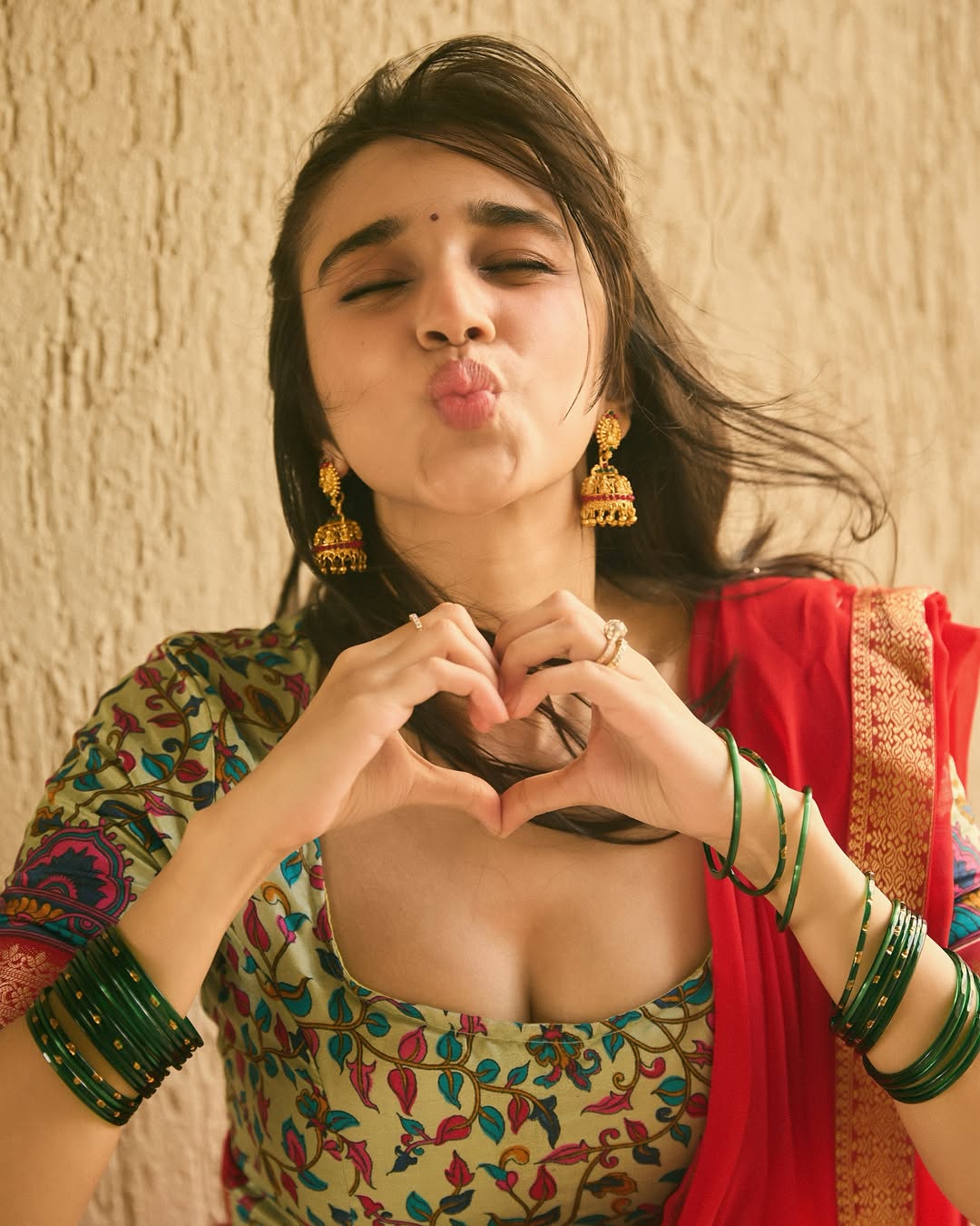 Nuveksha Stuns in a Colourful Red Saree and Mint Green Blouse
