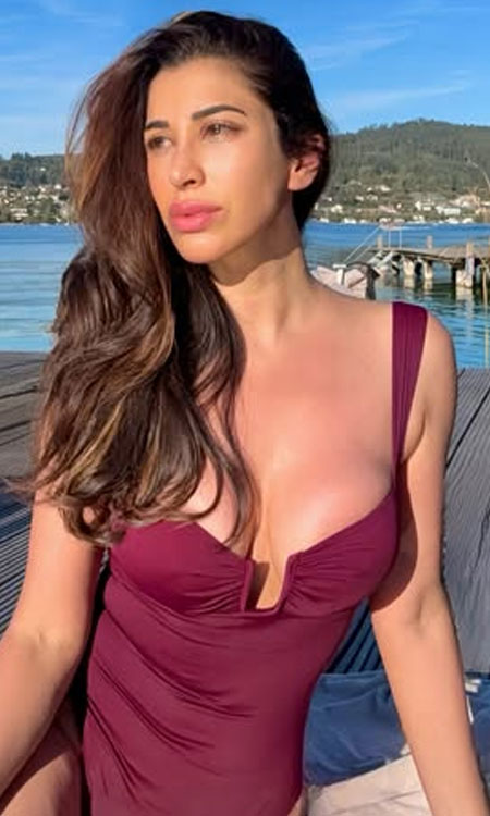 Sophie Choudry Stuns in a Maroon Swimsuit by an Austrian Lake