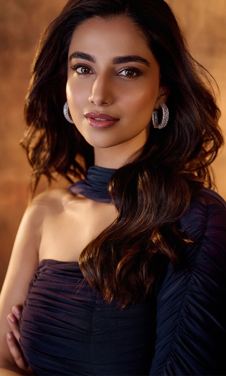 Meenaakshi Chaudhary Stuns in a Navy Blue One-Shoulder Dress