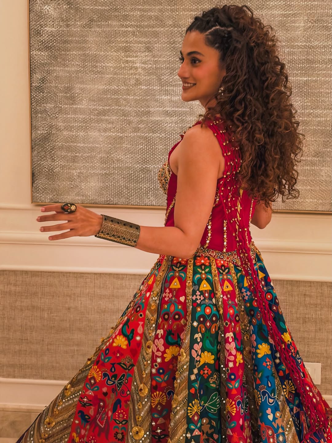 Taapsee Pannu stuns in a vibrant red lehenga with intricate mirror work