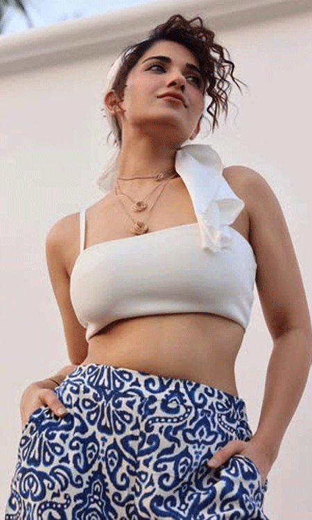Ruhani Sharma Stuns in a Chic White Crop Top and Printed Trousers