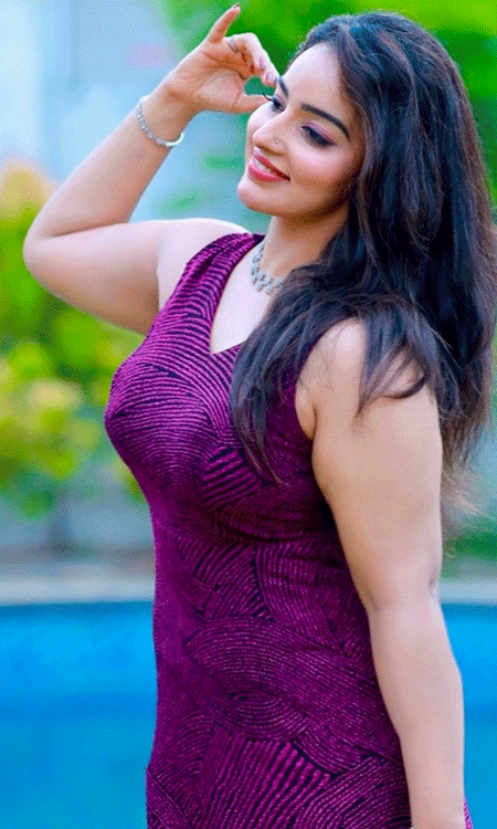 Malavika C Menon Adds Floral Charm to Her Chic Magenta Outfit