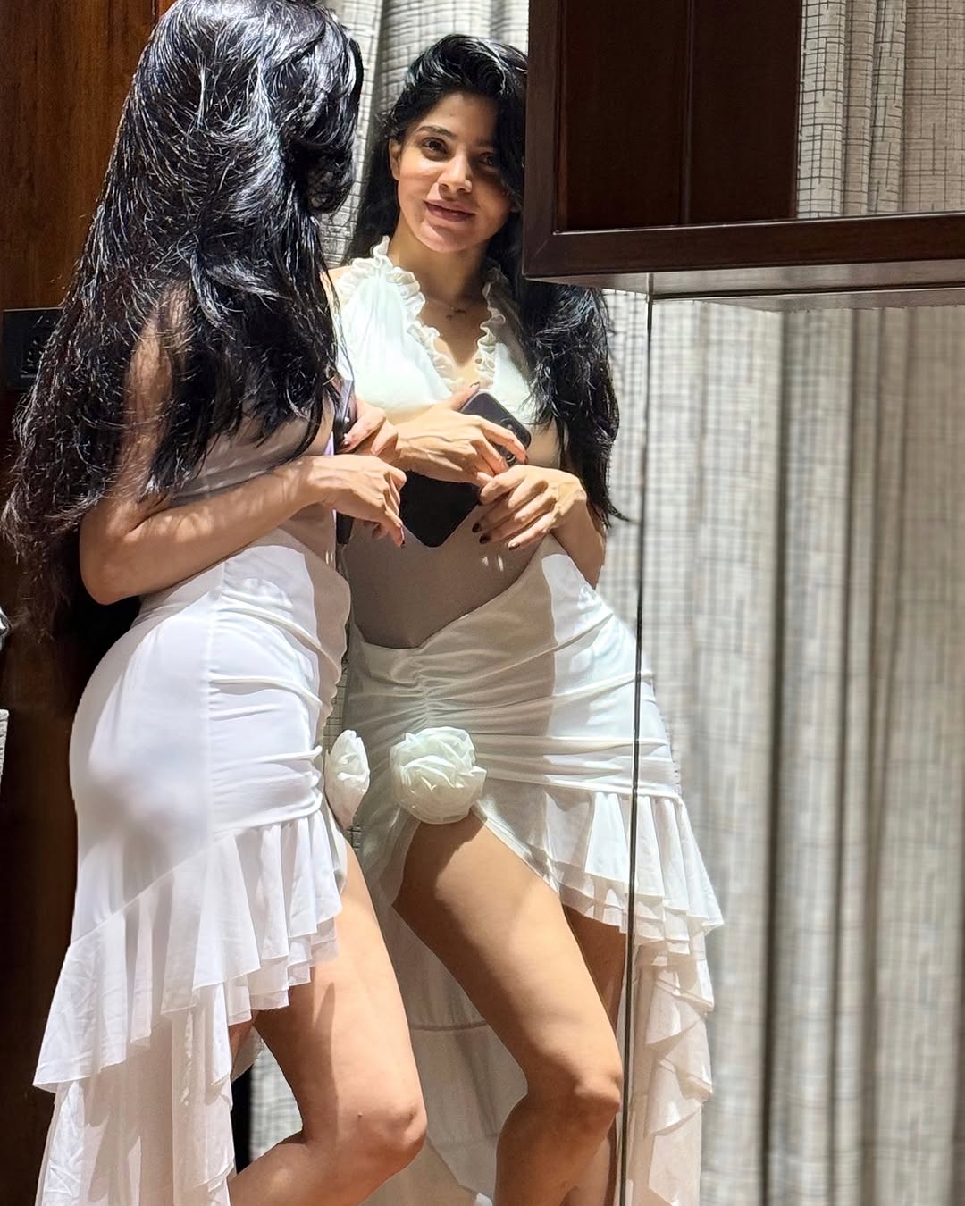 Divya Bharathi Looks Gorgeous in a White Ruffled Mini Dress
