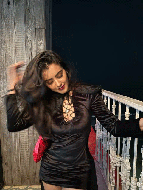 Malvika Sharma Pairs a Black Velvet Dress With a Bold Red Bag