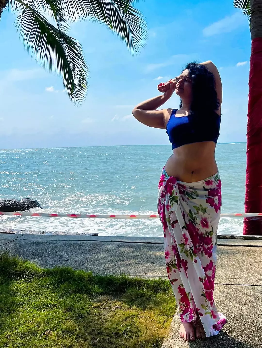 Poonam Bajwa’s Beachside Glow in Floral Wrap and Blue Top