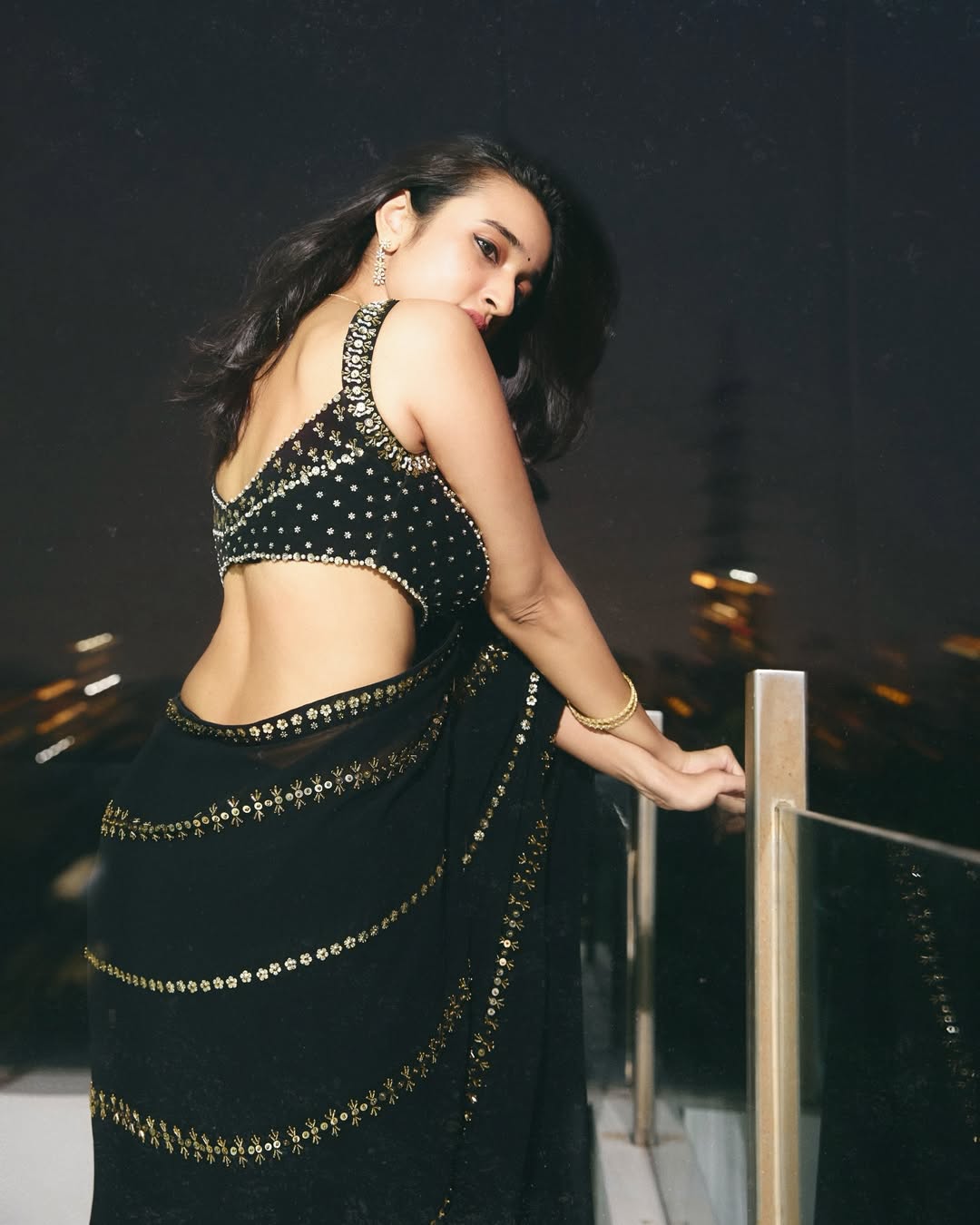 Nuveksha Charms in a Black Saree