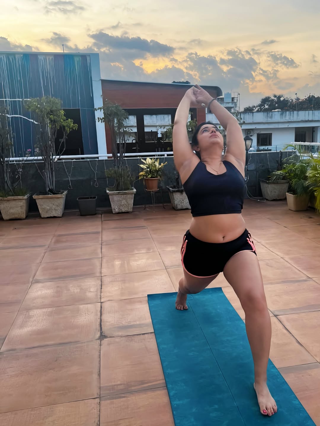 Poonam Bajwa Shines in Rooftop Yoga Pose Sunset Serenity