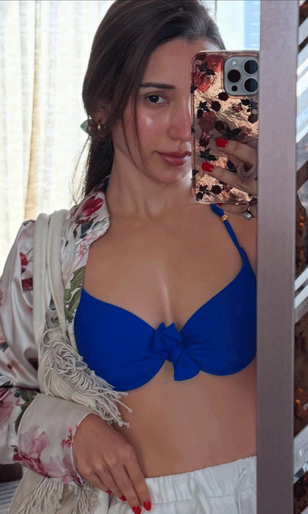 Heli Daruwala Glows in Blue Bikini Mirror Selfie