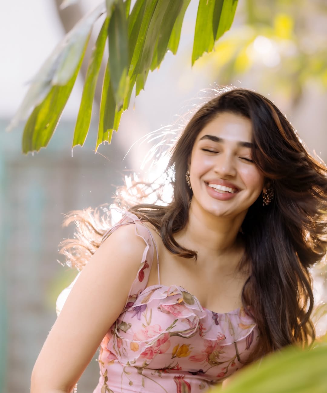 Krithi Shetty shines in pink floral dress with radiant charm and elegance