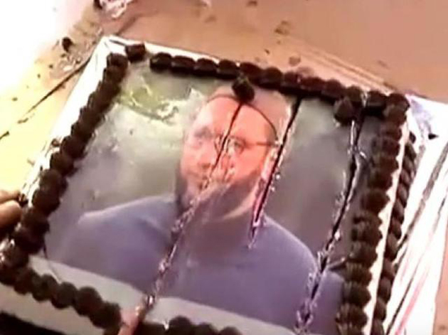 Who has cut the cake with Owaisis Picture?