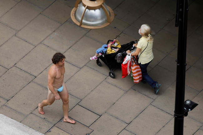 Man Walks In London Streets With Only Mask Covering Nudity