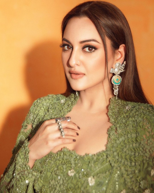 sonakshi sinha green dress Sonakshi Sinha stuns in a green thigh-high slit dress at the launch of her first offline exhibition | Photogallery